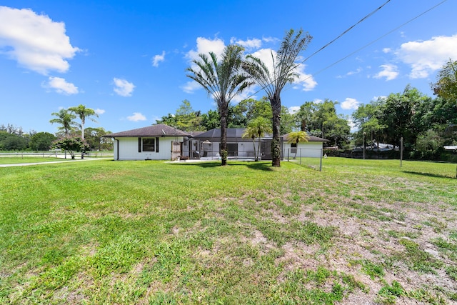 16888 W Stallion Dr, Loxahatchee, FL 33470 - view of yard featuring a lanai