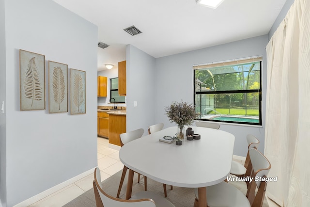 16888 W Stallion Dr, Loxahatchee, FL 33470 - dining room with light tile patterned floors and baseboards