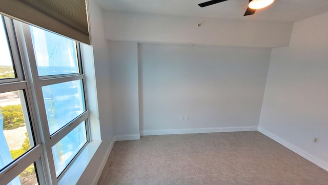 450 N Federal Hwy Unit 1101, Boynton Beach, FL 33435 - tiled spare room featuring ceiling fan and baseboards