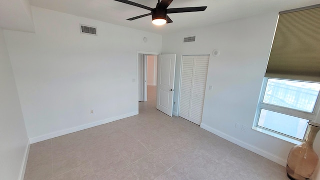 450 N Federal Hwy Unit 1101, Boynton Beach, FL 33435 - unfurnished bedroom with baseboards and ceiling fan