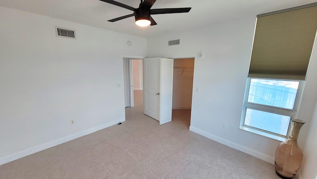 450 N Federal Hwy Unit 1101, Boynton Beach, FL 33435 - unfurnished bedroom with ceiling fan and a closet