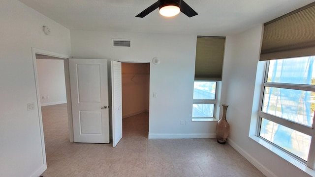 450 N Federal Hwy Unit 1101, Boynton Beach, FL 33435 - unfurnished bedroom featuring ceiling fan, a closet, and light tile patterned flooring