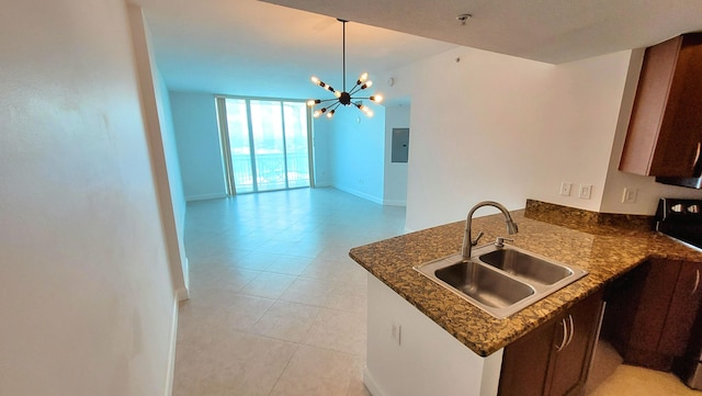 450 N Federal Hwy Unit 1101, Boynton Beach, FL 33435 - kitchen with dark stone counters, a chandelier, a peninsula, electric panel, and open floor plan