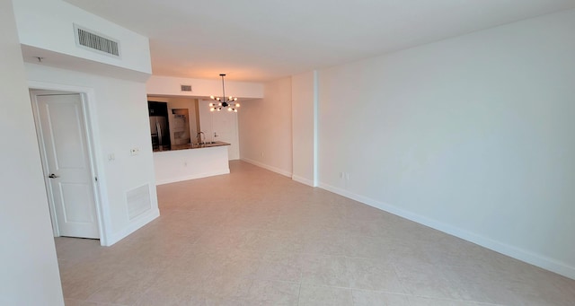 450 N Federal Hwy Unit 1101, Boynton Beach, FL 33435 - spare room with a chandelier and a sink