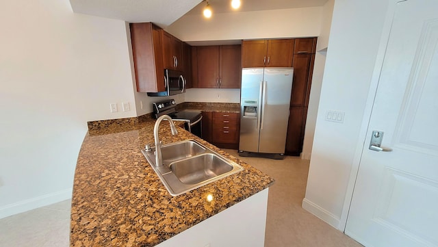 450 N Federal Hwy Unit 1101, Boynton Beach, FL 33435 - kitchen featuring appliances with stainless steel finishes, dark stone countertops, and a peninsula