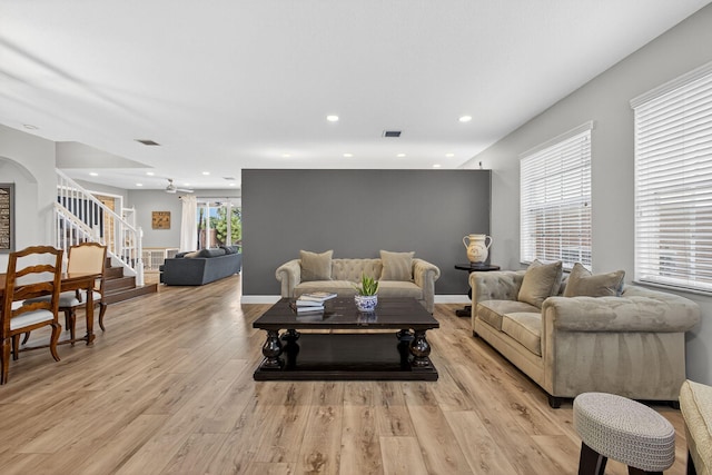 9196 Dupont Pl, Wellington, FL 33414 - living area featuring light wood finished floors, stairway, and recessed lighting