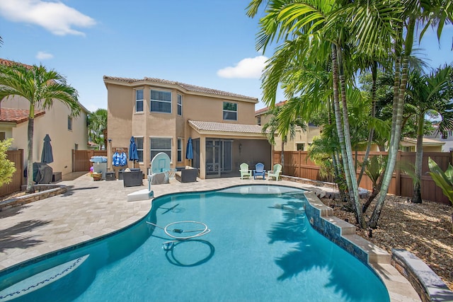 9196 Dupont Pl, Wellington, FL 33414 - view of pool with a patio area and a fenced backyard