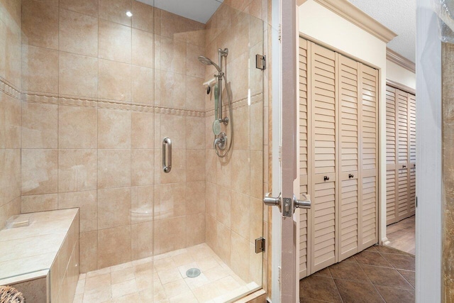 3843 Quail Ridge Drive Mallard, Boynton Beach, FL 33436 - bathroom featuring a stall shower, tile patterned floors, a closet, and crown molding
