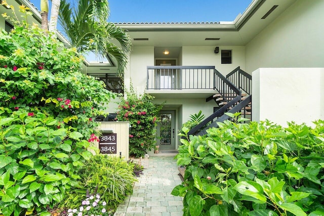 3843 Quail Ridge Drive Mallard, Boynton Beach, FL 33436 - view of exterior entry featuring stucco siding