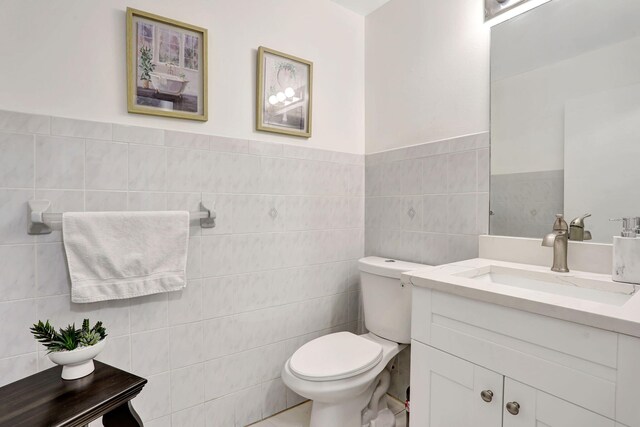3385 Seabreeze Ln, Margate, FL 33063 - bathroom with tile walls, vanity, and a wainscoted wall