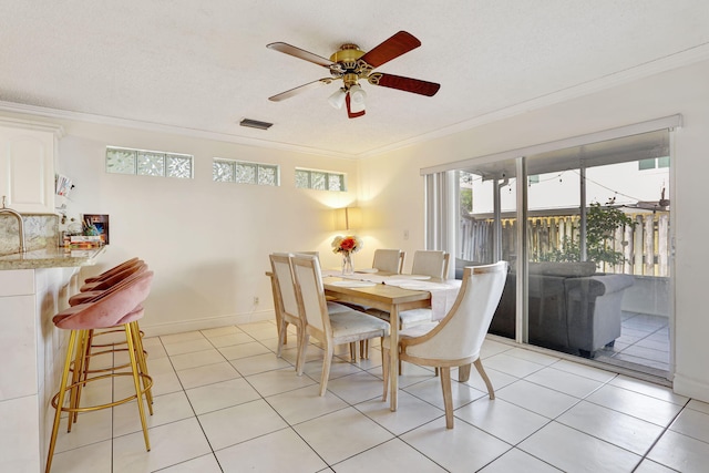 3385 Seabreeze Ln, Margate, FL 33063 - dining space with ornamental molding, ceiling fan, and light tile patterned floors