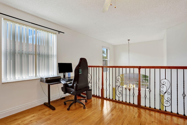 3385 Seabreeze Ln, Margate, FL 33063 - home office featuring wood finished floors, a textured ceiling, and a ceiling fan