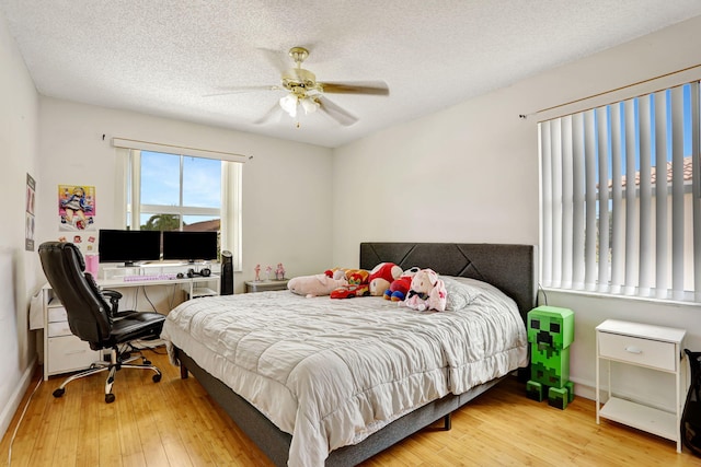 3385 Seabreeze Ln, Margate, FL 33063 - bedroom featuring wood finished floors, an office area, a ceiling fan, and a textured ceiling
