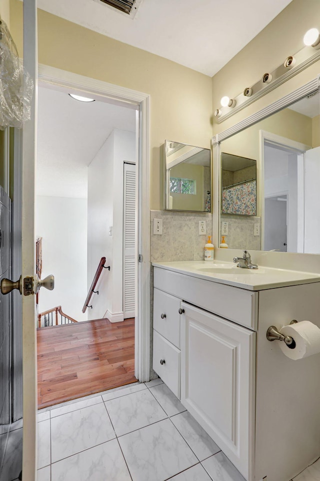 3385 Seabreeze Ln, Margate, FL 33063 - full bathroom featuring marble look tiles and vanity