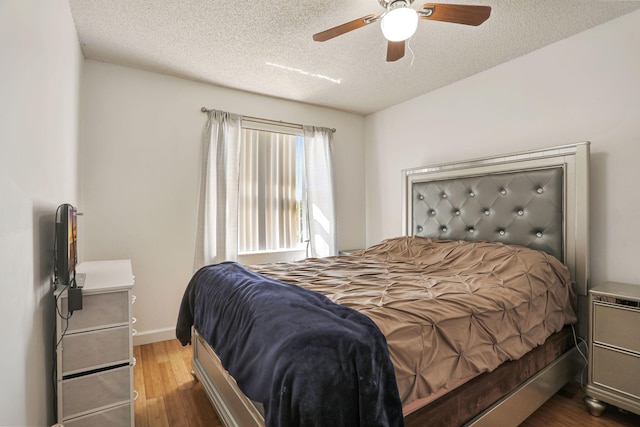 3385 Seabreeze Ln, Margate, FL 33063 - bedroom featuring wood finished floors, a textured ceiling, and a ceiling fan