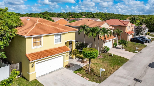 3385 Seabreeze Ln, Margate, FL 33063 - view of front facade with concrete driveway, a tile roof, and stucco siding