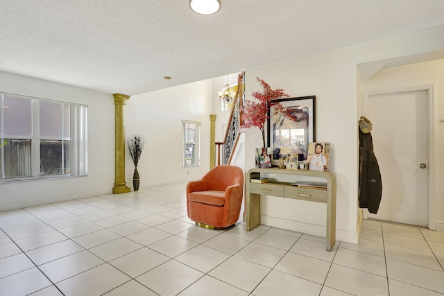 3385 Seabreeze Ln, Margate, FL 33063 - sitting room featuring a chandelier, light tile patterned flooring, and a textured ceiling