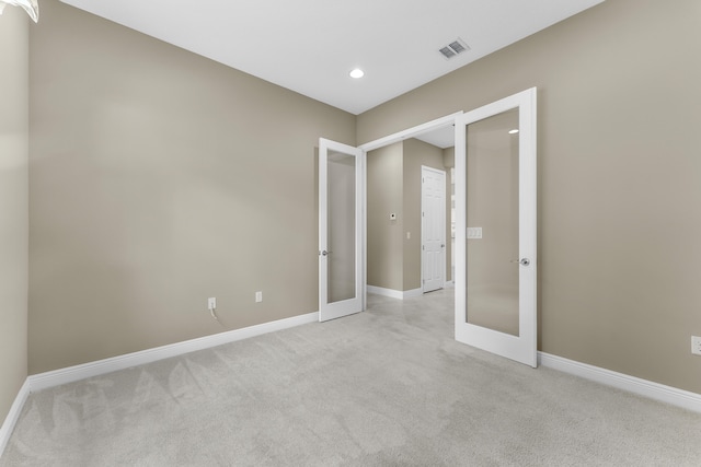 2854 Bellarosa Cir, Royal Palm Beach, FL 33411 - spare room with french doors, light carpet, and recessed lighting