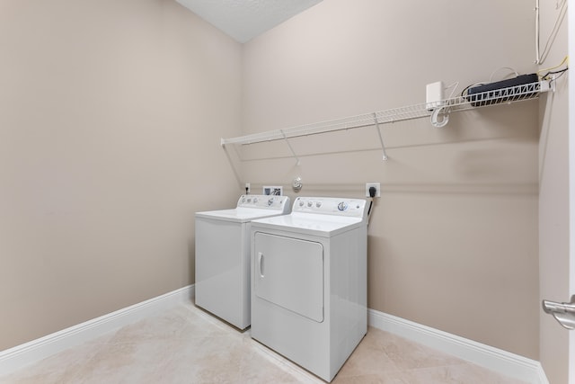 2854 Bellarosa Cir, Royal Palm Beach, FL 33411 - laundry room featuring washer and dryer and light tile patterned flooring