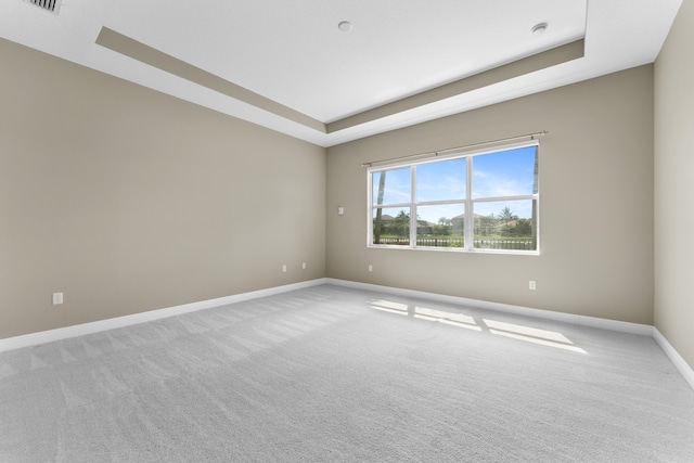 2854 Bellarosa Cir, Royal Palm Beach, FL 33411 - carpeted spare room featuring a tray ceiling and a smoke detector