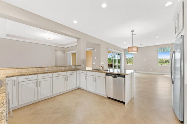 2854 Bellarosa Cir, Royal Palm Beach, FL 33411 - kitchen with stainless steel appliances, light tile patterned floors, light stone countertops, white cabinetry, and recessed lighting
