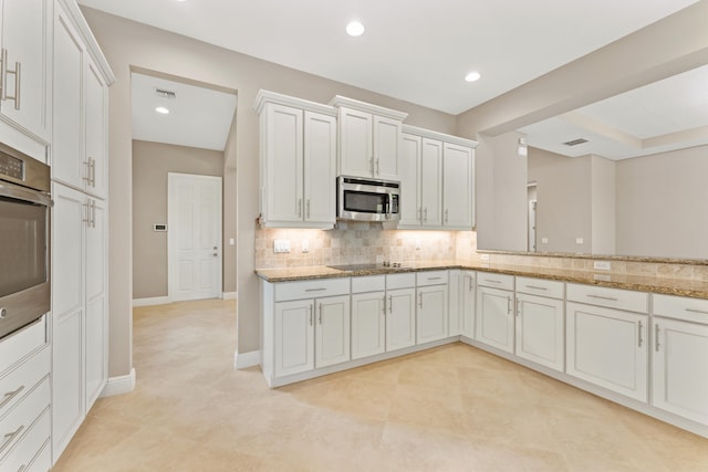 2854 Bellarosa Cir, Royal Palm Beach, FL 33411 - kitchen with appliances with stainless steel finishes, backsplash, light stone countertops, recessed lighting, and white cabinetry