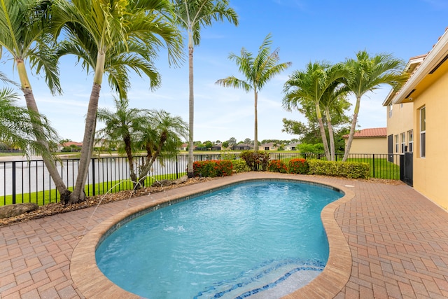 2854 Bellarosa Cir, Royal Palm Beach, FL 33411 - view of pool featuring a water view and a fenced backyard