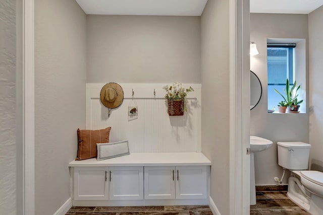 4610 SW Ardsley Dr, Stuart, FL 34997 - mudroom featuring baseboards and dark wood-style flooring