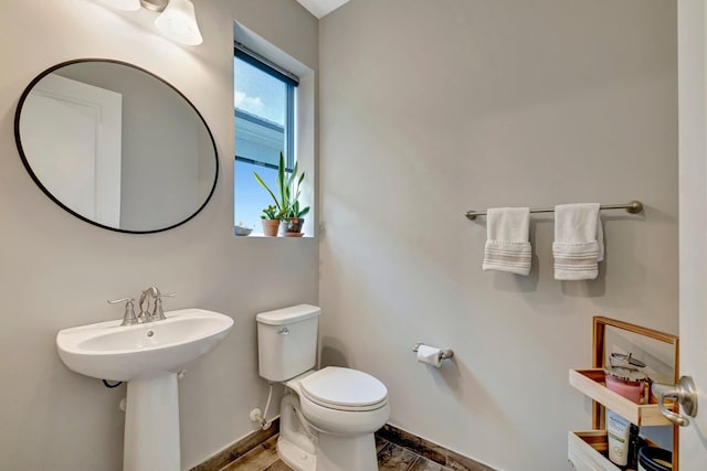 4610 SW Ardsley Dr, Stuart, FL 34997 - bathroom with toilet and wood finished floors