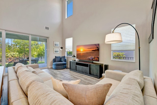 4610 SW Ardsley Dr, Stuart, FL 34997 - living area with wood finished floors and a towering ceiling