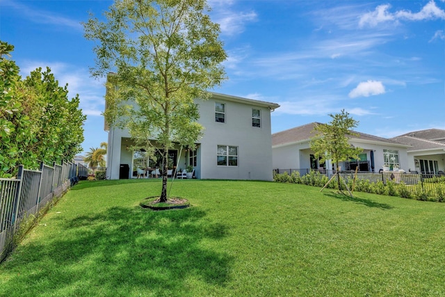 4610 SW Ardsley Dr, Stuart, FL 34997 - back of house featuring stucco siding and a fenced backyard