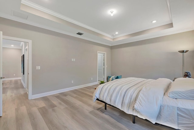 4610 SW Ardsley Dr, Stuart, FL 34997 - bedroom featuring a tray ceiling, light wood-type flooring, crown molding, and recessed lighting