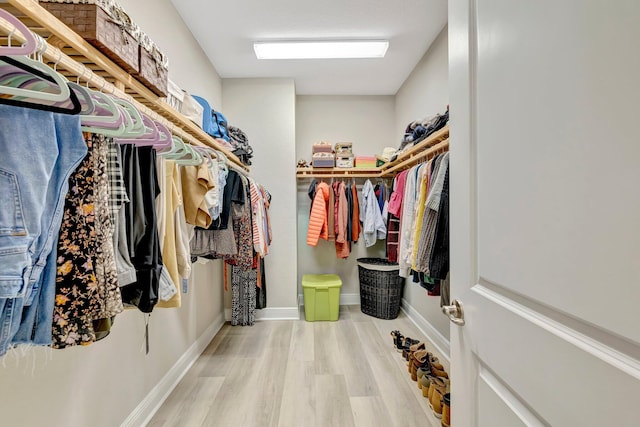 4610 SW Ardsley Dr, Stuart, FL 34997 - walk in closet featuring wood finished floors