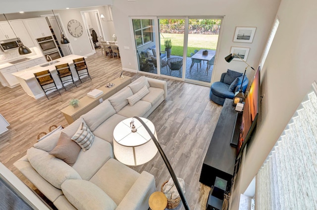 4610 SW Ardsley Dr, Stuart, FL 34997 - living area with light wood-style flooring and recessed lighting