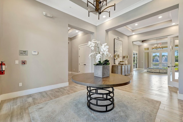 4610 SW Ardsley Dr, Stuart, FL 34997 - foyer entrance with a chandelier, light wood-style flooring, a water view, recessed lighting, and a towering ceiling