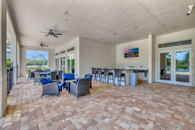 4610 SW Ardsley Dr, Stuart, FL 34997 - view of patio / terrace featuring french doors, outdoor lounge area, and ceiling fan
