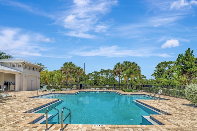 4610 SW Ardsley Dr, Stuart, FL 34997 - community pool featuring a patio area