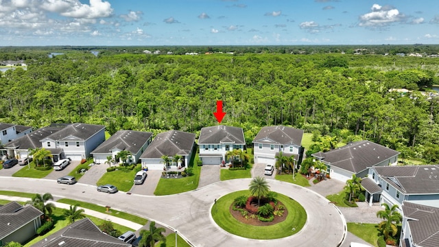 4610 SW Ardsley Dr, Stuart, FL 34997 - aerial perspective of suburban area featuring a heavily wooded area