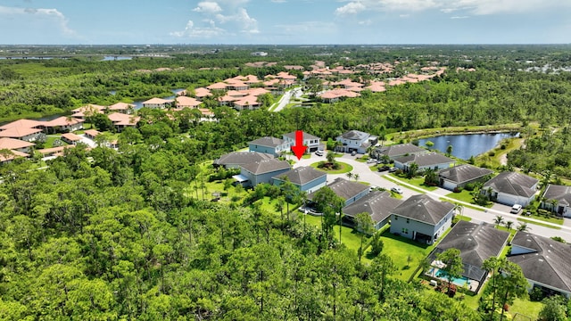 4610 SW Ardsley Dr, Stuart, FL 34997 - aerial view of residential area featuring a heavily wooded area and a nearby body of water