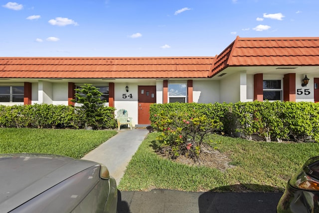 5800 Fernley Dr W Unit 54, West Palm Beach, FL 33415 - view of front facade featuring a tiled roof and stucco siding