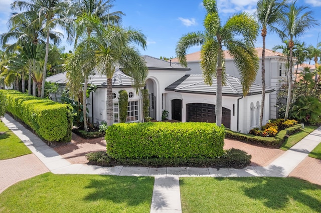 16284 Via Venetia W, Delray Beach, FL 33484 - view of front of home with a garage, a front lawn, stucco siding, and a tiled roof