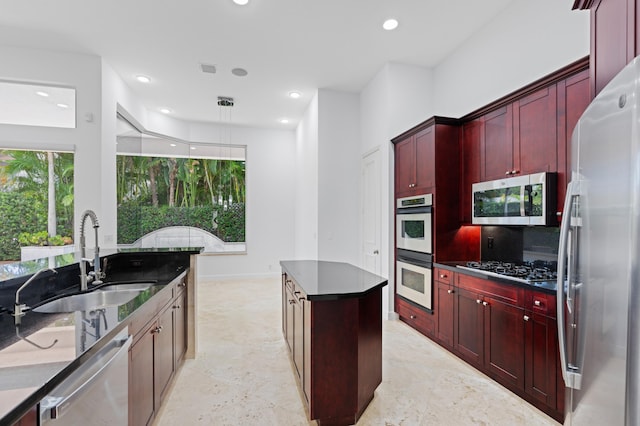 16284 Via Venetia W, Delray Beach, FL 33484 - kitchen with dark brown cabinets, stainless steel appliances, a center island, recessed lighting, and tasteful backsplash