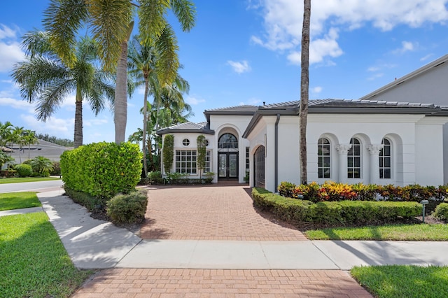 16284 Via Venetia W, Delray Beach, FL 33484 - view of property with decorative driveway and an attached garage
