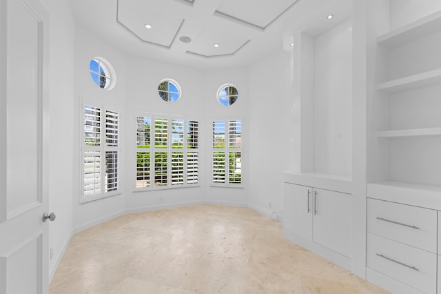 16284 Via Venetia W, Delray Beach, FL 33484 - empty room with coffered ceiling, a high ceiling, recessed lighting, built in features, and beamed ceiling