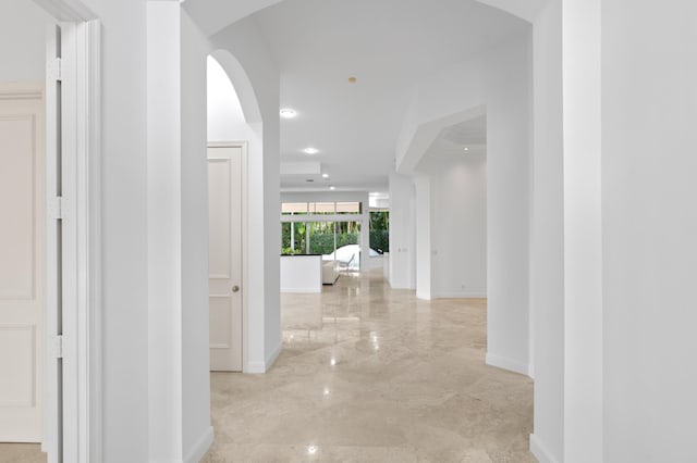 16284 Via Venetia W, Delray Beach, FL 33484 - hallway with light marble finish floors, arched walkways, and recessed lighting