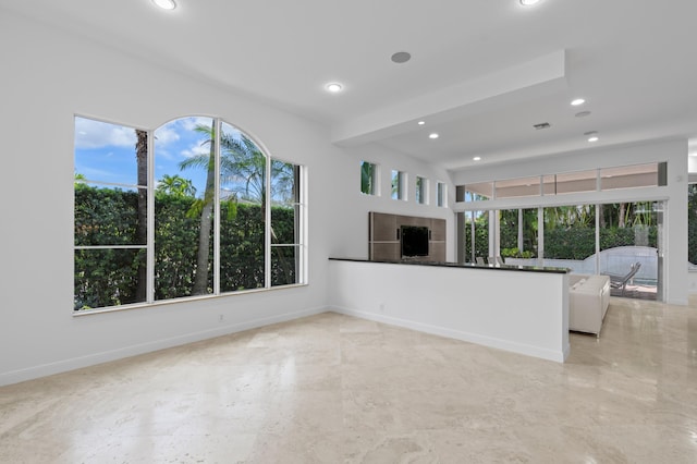 16284 Via Venetia W, Delray Beach, FL 33484 - unfurnished living room featuring a fireplace and recessed lighting