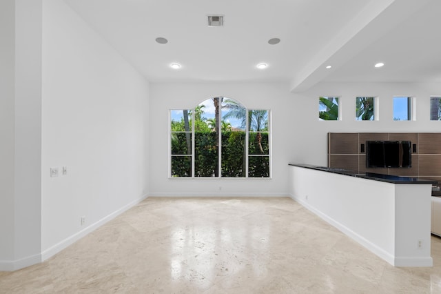 16284 Via Venetia W, Delray Beach, FL 33484 - unfurnished living room with baseboards and recessed lighting