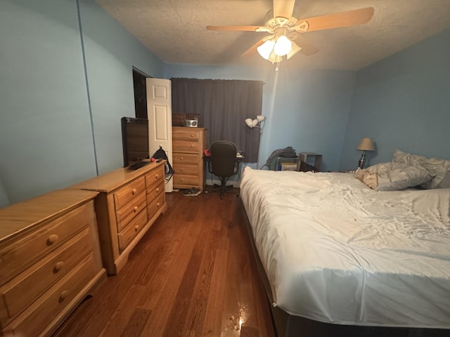 117 Lake Pine Cir Unit C-1, Greenacres, FL 33463 - bedroom with dark wood finished floors, an office area, a textured ceiling, and ceiling fan