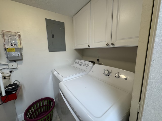 117 Lake Pine Cir Unit C-1, Greenacres, FL 33463 - laundry room featuring electric panel, washer and clothes dryer, and cabinet space