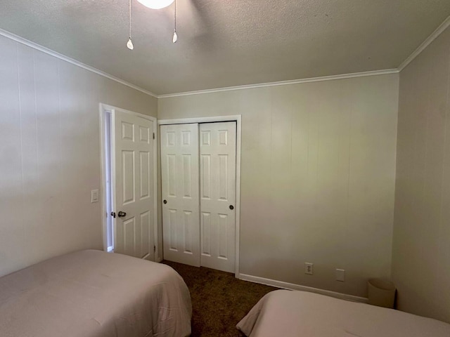 148 Yacht Club Dr Unit 13, North Palm Beach, FL 33408 - bedroom featuring ornamental molding, dark carpet, a closet, and a textured ceiling
